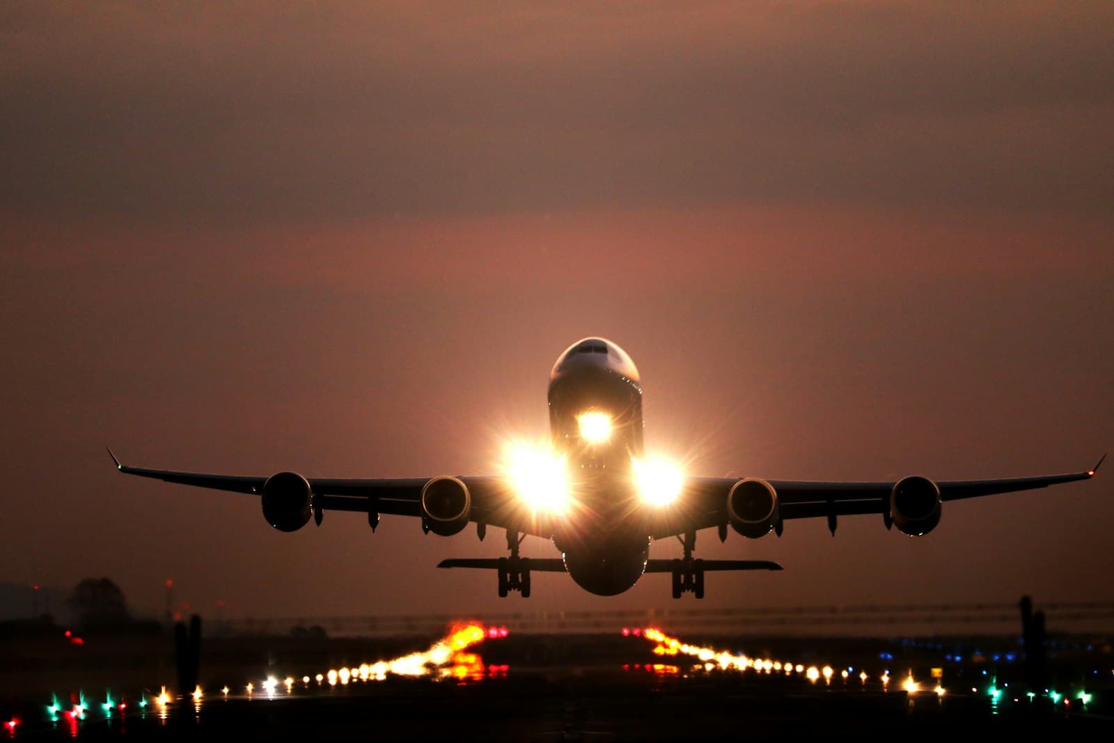Airliner departing at dusk